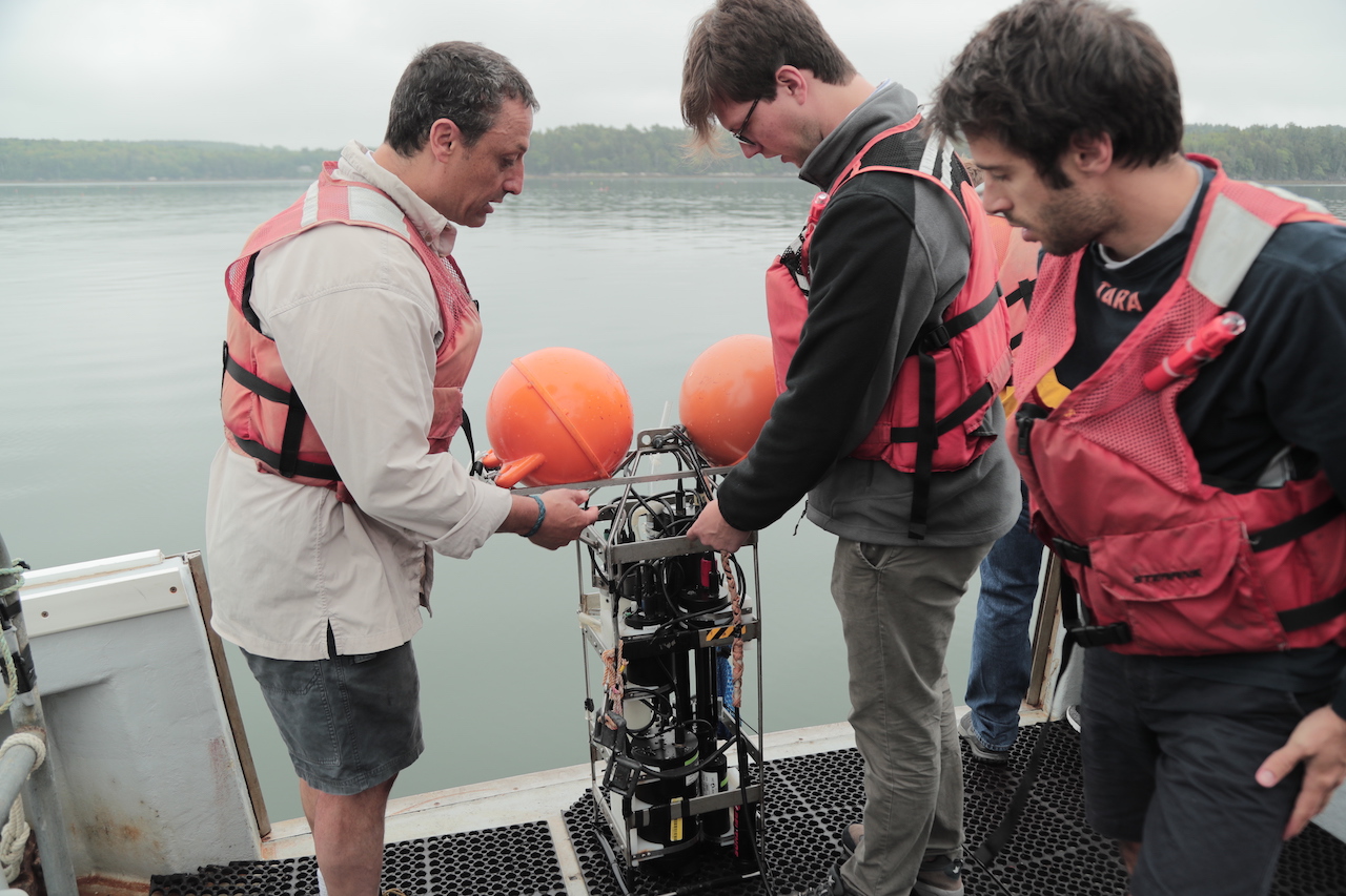 Boss instructs students using oceanographic equipment aboard the research vessel. Photo courtesy of Michael Starobin.