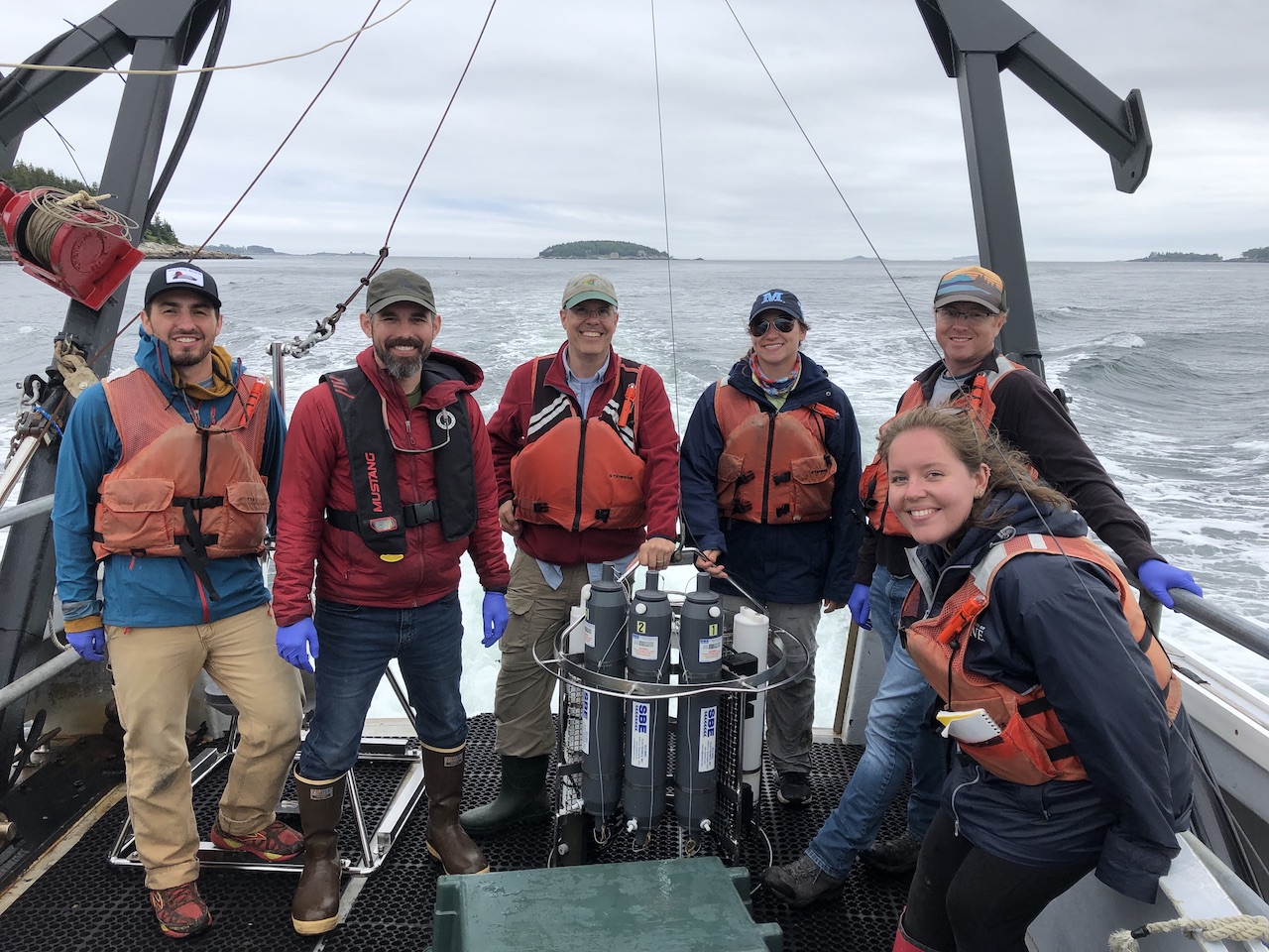 Researchers on boat